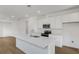 Open kitchen with quartz countertops, stainless steel appliances, and ample cabinet space at 6385 Clover St, Lake Hamilton, FL 33851