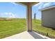 Covered patio with view of the backyard at 6385 Clover St, Lake Hamilton, FL 33851