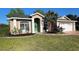 Charming single-story home with a well-manicured lawn and attached two car garage at 738 Leonardo Ct, Kissimmee, FL 34758