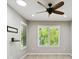 Modern bedroom showcasing a ceiling fan, recessed lighting, and a large window with natural light at 789 Cielo Trl, Kissimmee, FL 34759
