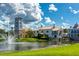 Community buildings reflected in lake with beautiful landscape at 789 Cielo Trl, Kissimmee, FL 34759