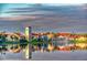Community buildings reflected in lake with beautiful landscape at 789 Cielo Trl, Kissimmee, FL 34759