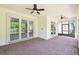 Relaxing covered patio area with brick flooring and ceiling fans at 789 Cielo Trl, Kissimmee, FL 34759