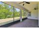 Screened-in porch with brick floors and a serene view of the backyard at 789 Cielo Trl, Kissimmee, FL 34759