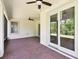View of the covered patio, featuring brick floors and ceiling fans at 789 Cielo Trl, Kissimmee, FL 34759