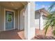 Inviting front porch featuring a decorative glass door, column, and brick pavers at 789 Cielo Trl, Kissimmee, FL 34759