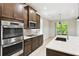 Gourmet kitchen featuring stainless steel appliances and a spacious island with sink at 789 Cielo Trl, Kissimmee, FL 34759