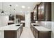 Open kitchen with stainless appliances, central island, and plenty of cabinet space at 789 Cielo Trl, Kissimmee, FL 34759
