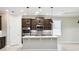 Modern kitchen with stainless steel appliances and a large central island at 789 Cielo Trl, Kissimmee, FL 34759