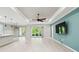 Bright open floor plan features an integrated living and kitchen space with recessed lighting and patio access at 789 Cielo Trl, Kissimmee, FL 34759