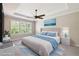 Relaxing bedroom featuring a plush king-size bed, soft natural light, and a ceiling fan for added comfort at 789 Cielo Trl, Kissimmee, FL 34759