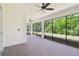 Enjoy outdoor living on this screened patio with brick flooring, ceiling fans, and views of the natural surroundings at 789 Cielo Trl, Kissimmee, FL 34759
