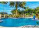 Outdoor pool with many chairs and tables and landscaping at 789 Cielo Trl, Kissimmee, FL 34759