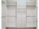 Organized walk-in closet with built-in shelving and drawers for ample storage space at 789 Cielo Trl, Kissimmee, FL 34759