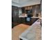 The kitchen has black appliances, light countertops, and decorative backsplash at 13 Dorset Dr, Kissimmee, FL 34758