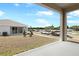 Home featuring a backyard view from the lanai with a lawn, and a view of the neighborhood at 1654 Sugarbelle Cir, Mascotte, FL 34753