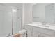 Bright bathroom featuring a walk-in shower, single vanity, and a commode at 1654 Sugarbelle Cir, Mascotte, FL 34753