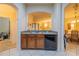 Open-concept kitchen with a breakfast bar, granite countertops, and stainless steel appliances at 3301 Whitestone Cir # 203, Kissimmee, FL 34741