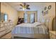Cozy bedroom with a decorative ceiling fan and matching furnishings at 3301 Whitestone Cir # 203, Kissimmee, FL 34741