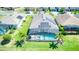 Overhead view of backyard with pool and solar panels on this lovely property at 363 Bella Cortina Dr, Kissimmee, FL 34759