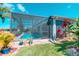 Backyard view of the enclosed pool and landscaping from the grass at 363 Bella Cortina Dr, Kissimmee, FL 34759