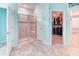 Bathroom featuring tile floors, a glass shower and access to the walk-in closet, enhancing the functionality of the space at 363 Bella Cortina Dr, Kissimmee, FL 34759