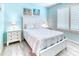 Cozy bedroom with a window, a bed and bedside tables for a relaxing and peaceful space at 363 Bella Cortina Dr, Kissimmee, FL 34759