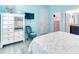 Light and airy bedroom features a walk in closet, dresser and blue starfish themed decor at 363 Bella Cortina Dr, Kissimmee, FL 34759
