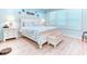 Serene bedroom with plantation shutters, light wood floors, and coastal decor at 363 Bella Cortina Dr, Kissimmee, FL 34759