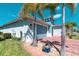 Beautiful home showing the two-car garage, a lush lawn, and a brick-paved driveway at 363 Bella Cortina Dr, Kissimmee, FL 34759