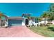 Charming single-story home with a paved driveway and well-manicured lawn at 363 Bella Cortina Dr, Kissimmee, FL 34759