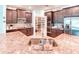 Gourmet kitchen with stainless steel appliances, granite countertops, and walk-in pantry at 363 Bella Cortina Dr, Kissimmee, FL 34759