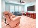 Spacious living room featuring large windows, plantation shutters, ceiling fan and comfortable furniture at 363 Bella Cortina Dr, Kissimmee, FL 34759