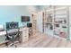 A well-lit office with functional workspace, storage, and closet, ideal for remote work at 363 Bella Cortina Dr, Kissimmee, FL 34759