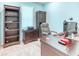 Bright office space featuring a desk, storage cabinets, and window allowing for natural light at 363 Bella Cortina Dr, Kissimmee, FL 34759