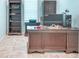 Office space featuring a custom desk, and built-in shelving providing ample storage at 363 Bella Cortina Dr, Kissimmee, FL 34759