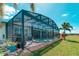 The screened-in lanai features a pool, spa, and outdoor living space at 363 Bella Cortina Dr, Kissimmee, FL 34759