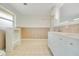 Bright bathroom featuring double vanity, updated fixtures, and custom wood accents at 7938 Riffle Ln, Orlando, FL 32818