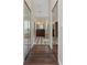 A bathroom hallway featuring mirrored closet doors and a view of the bathroom amenities at 9509 Baycliff Ct, Orlando, FL 32836
