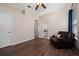 Bedroom features hardwood floors, an ensuite bathroom and a vaulted ceiling with fan at 9509 Baycliff Ct, Orlando, FL 32836