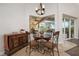 Breakfast nook has views of pool and access to covered patio through sliding glass doors at 9509 Baycliff Ct, Orlando, FL 32836