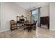 Formal dining room offers neutral paint, tiled floor, and traditional furnishings at 9509 Baycliff Ct, Orlando, FL 32836