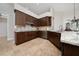 Updated kitchen with wooden cabinets, stainless appliances, and granite countertops at 9509 Baycliff Ct, Orlando, FL 32836