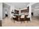 Kitchen island with countertop seating, decorative pendant lights, and tile flooring at 9509 Baycliff Ct, Orlando, FL 32836