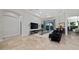 Modern living room features tile floors, recessed lights and large sliding doors at 9509 Baycliff Ct, Orlando, FL 32836