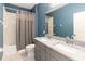 Bathroom with double vanity, shower and tub combo at 1180 Lone Palm Way, St Cloud, FL 34771