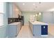 Well-equipped kitchen with a central island and stainless steel appliances at 1180 Lone Palm Way, St Cloud, FL 34771