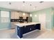 Contemporary kitchen featuring an island, stainless steel appliances, and sleek cabinetry at 1180 Lone Palm Way, St Cloud, FL 34771