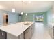 Spacious kitchen with island features stainless appliances and slider to outdoors at 1180 Lone Palm Way, St Cloud, FL 34771
