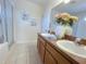 Bathroom with a double sink vanity and decorative accents at 141 Summer Place Loop, Clermont, FL 34714